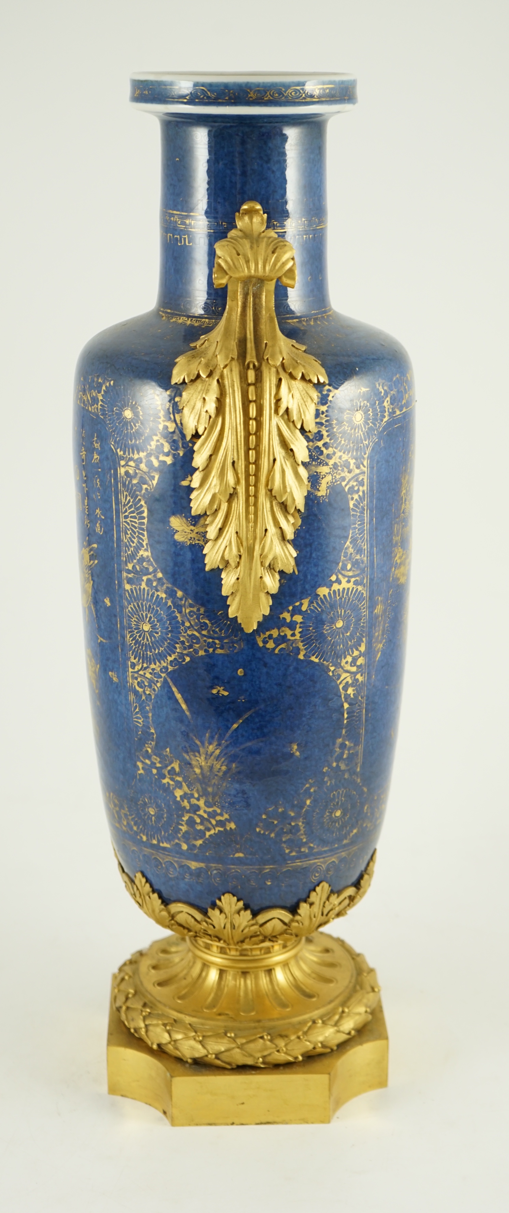 A Chinese gilt-decorated powder blue rouleau vase, Kangxi period, with French ormolu mounts, 55 cm high including ormolu mounts